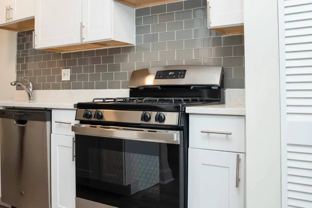 1251 W. Henderson St, Apt 1 — kitchen with quartz counters and subway tile backsplash