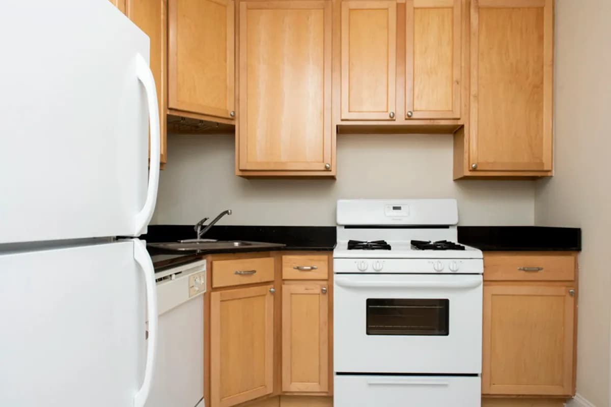3323 N. Lakewood Ave, Apt 1 — full kitchen view with sink and gas range
