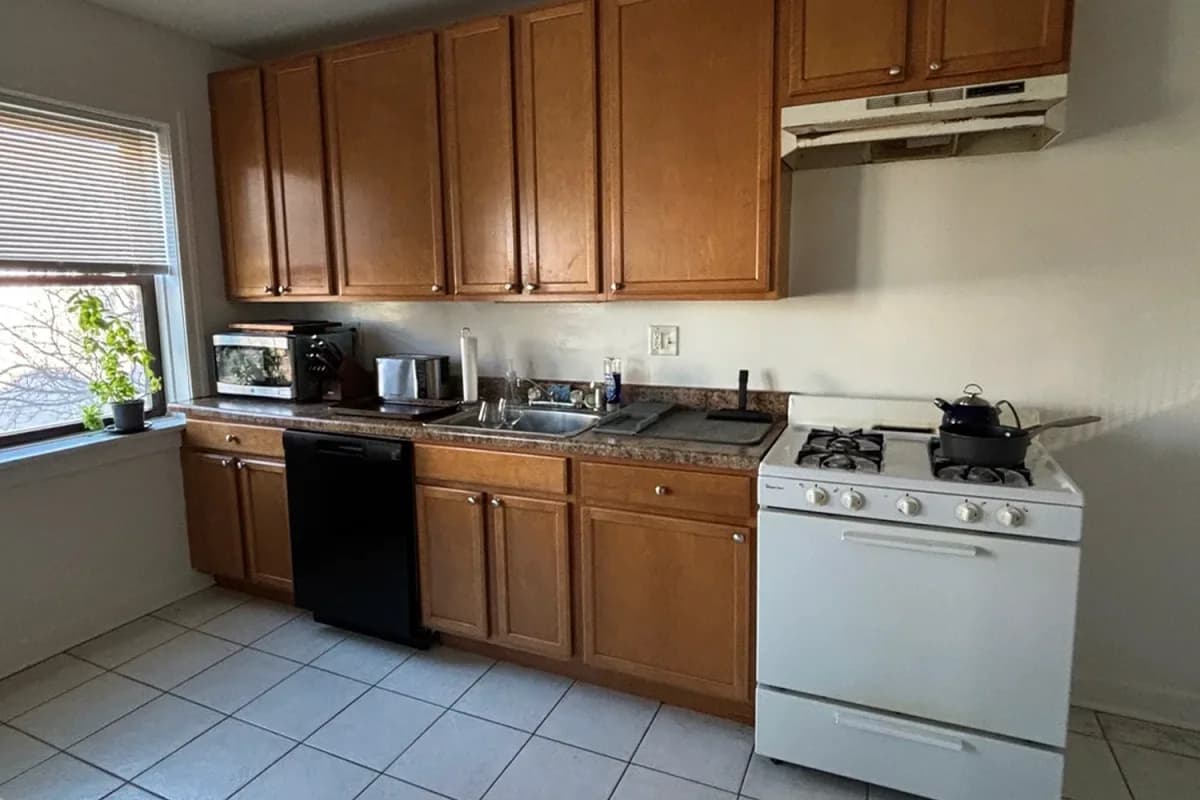 3325 N. Lakewood Ave, Apt 2 — kitchen with wood cabinetry and tile floor