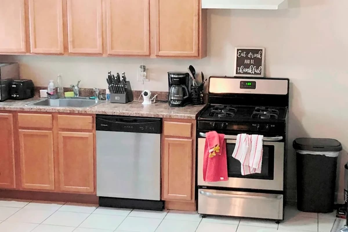 3325 N. Lakewood Ave, Apt G — kitchen with wood cabinetry and stainless appliances