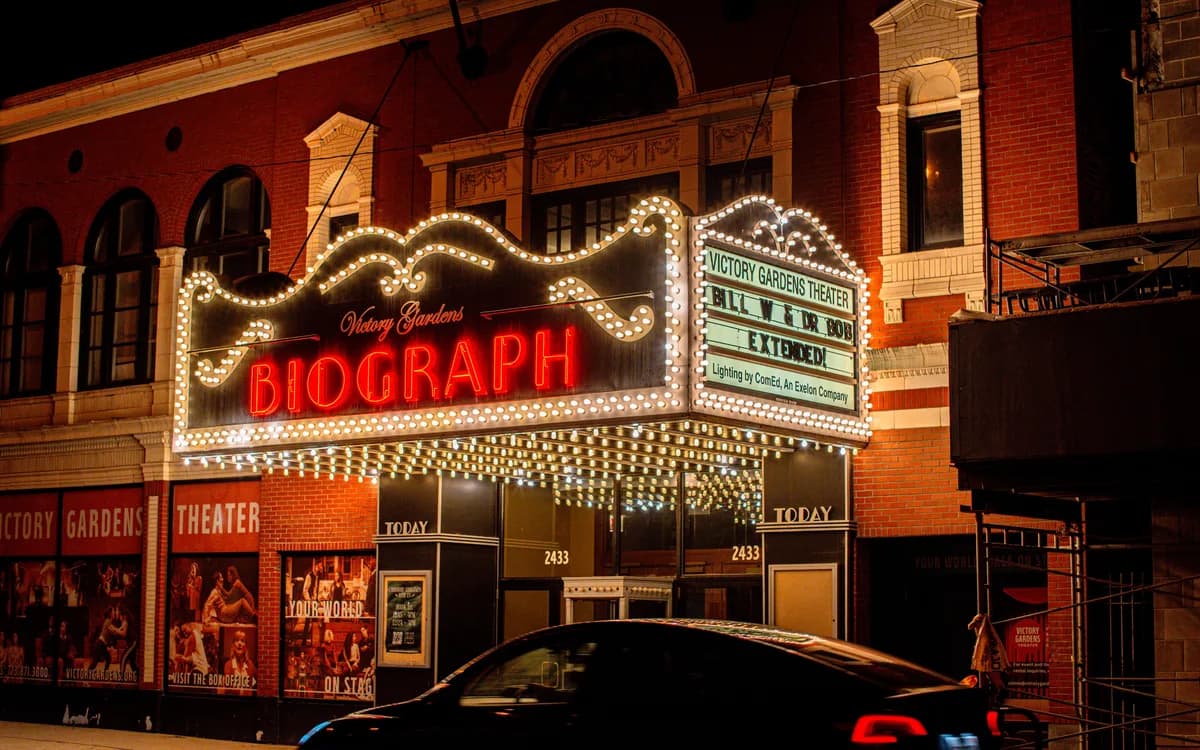 The illuminated marquee of the historic Biograph Theater on Lincoln Avenue at night
